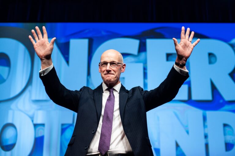 Scotland's First Minister and leader of the SNP, John Swinney MSP, on stage at SNP Conference.