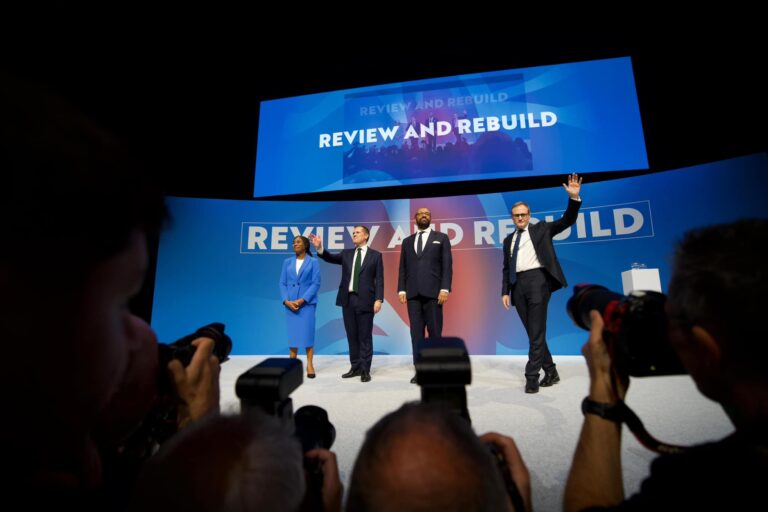 Conservative MPs and leadership candidates Kemi Badenoch, Robert Jenrick, Shadow Home Secretary James Cleverly and Tom Tugendhat stand together on stage on the final day of the Conservative Party conference in Birmingham, UK.