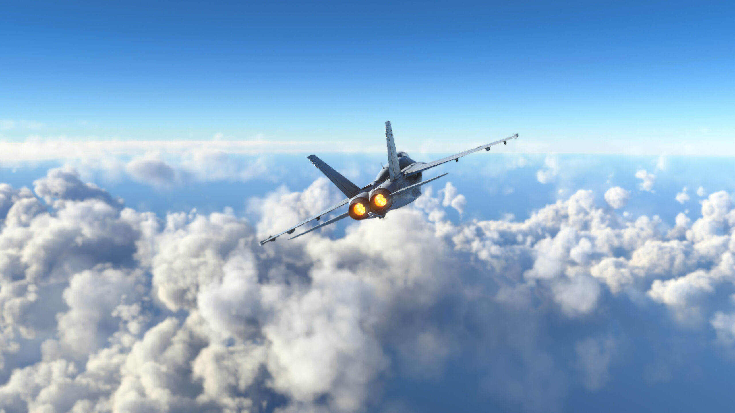 Militar aircraft flying over the clouds